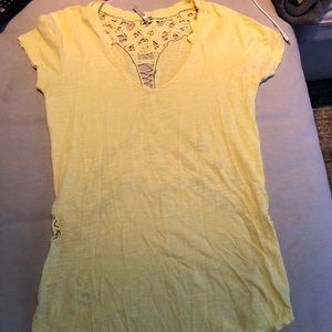 Free People yellow tee with crochet detailing.
